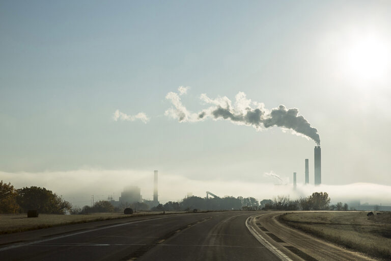 Refinery smoke stacks from distance