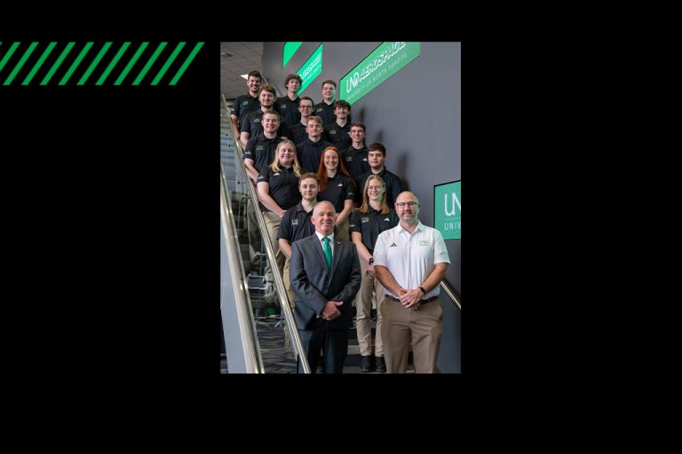 UND Flying Team posed on stairway with coaches standing at front