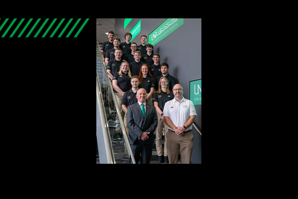 UND Flying Team posed on stairway with coaches standing at front