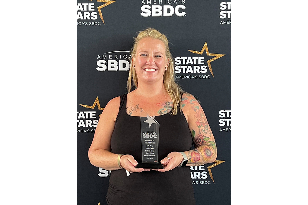 Ashley Louw holding state star award