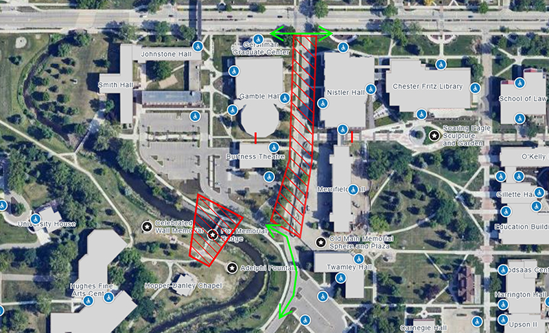 Campus map centered on Centennial Drive with red hashes showing the closure area from University Avenue to Davis Drive. Red hashes also cover the area of Fox Memorial Bridge, signifying its closure. Green arrows along University Avenue and Davis Drive signify that those streets will remain open.