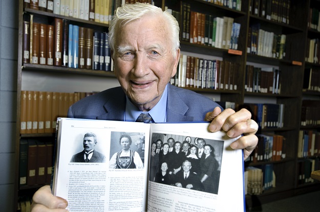 For nearly 35 years, Arne Brekke has led the effort to collect copies of bygdeboker, Norwegian compilations of local genealogical, cultural and geographical information. The collection recently surpassed 1,600 volumes at UND's Department of Special Collections. Photo by Jackie Lorentz.