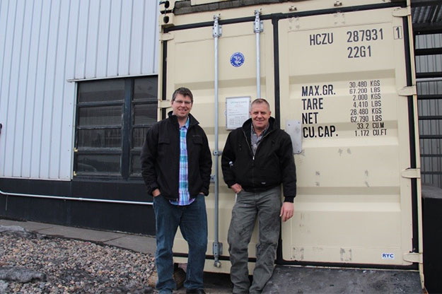 Dan Laudal (left), engineer and major projects manager at the UND College of Engineering & Mines’ (COE) Institute for Energy Studies, stands with Harry Feilen, manager of operations and safety at the COE, at a carbon-capture test site on the UND campus. Photo courtesy of the College of Engineering & Mines.