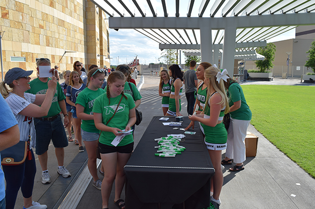 UND Fighting Hawks cheerleaders welcome some of the more than 2,000 UND supporters who showed up to root for the Minnesota Twins against the Baltimore Orioles.
