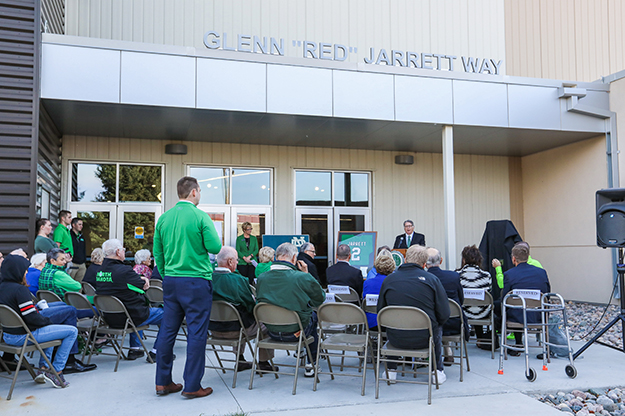 UND Athletic Director Brian Faison addresses the audience at the dedication of Glenn "Red" Jarrett Way" over the entrance of the school's High Performance Center on Friday, Oct. 20. Red Jarrett was UND first All-American athlete and would later serve as a UND athletic director. Photo by Jackie Lorentz/UND Today.