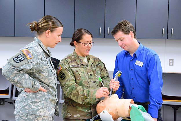 Members of the North Dakota National Guard Delta Company 1-112th Aviation Battalion, based in Fargo, recently took advantage of realistic training by officials with UND's physician assistant program and the Simulation Center, housed with in the School of Medicine & Health Sciences. Images courtesy of the SMHS.