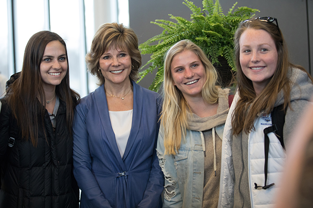 Susan Marvin takes a moment for a photo with some Hultberg Lecture attendees. Marvin told students to ask themselves "not just what you want to do, but why," and that Americans are hungry for community-strengthening companies. Photo by Jackie Lorentz/UND Today.