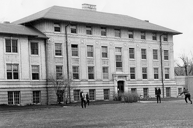 Sayre Hall functioned as a men's dormitory for most of its life along University Avenue. Designed by prominent New York City architect, A. Wallace McRae, in the Beaux Arts style, it cut a sophisticated and cosmopolitan figure on the Wesley College campus, of which it was a part for much of its history. UND Archival photo. 