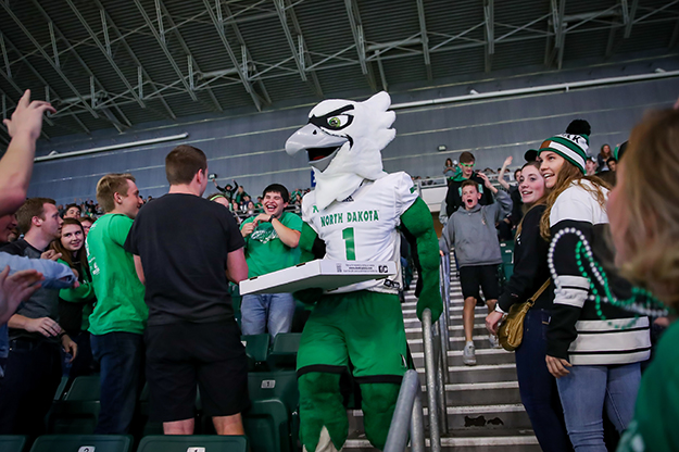The newest addition to UND Athletics made its rounds during the game - engaging fans young and old. Photo by Shawna Schill/UND Today.