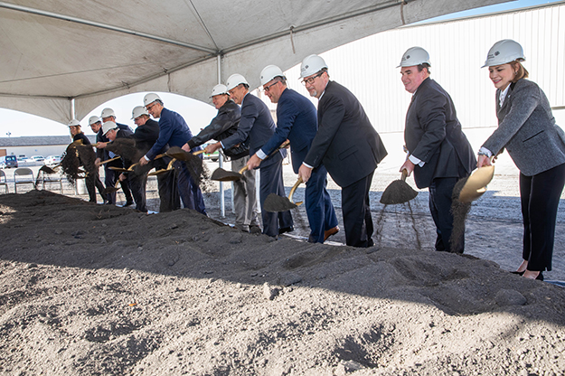 Representatives from UND and Johnson Controls, Inc., along with Grand Forks Mayor Michael Brown and State Sen. Ray Holmberg, throw the ceremonial dirt on a new steam plant project that will replace the century-old plant now located in the heart of campus. Photo by Jackie Lorentz/UND Today.