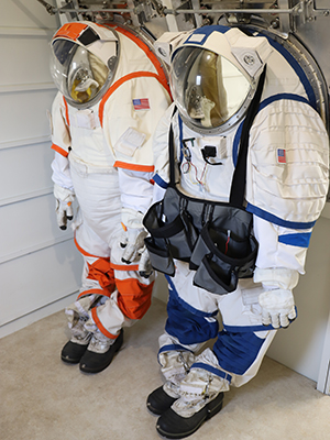 Spacesuits hang in the IMLH