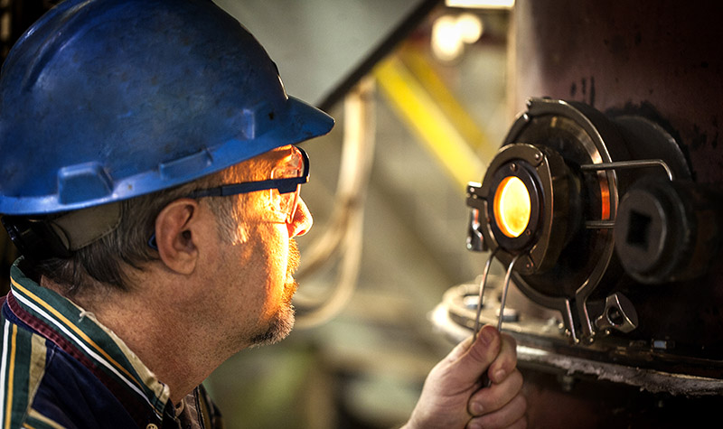 Person observes burning fuel