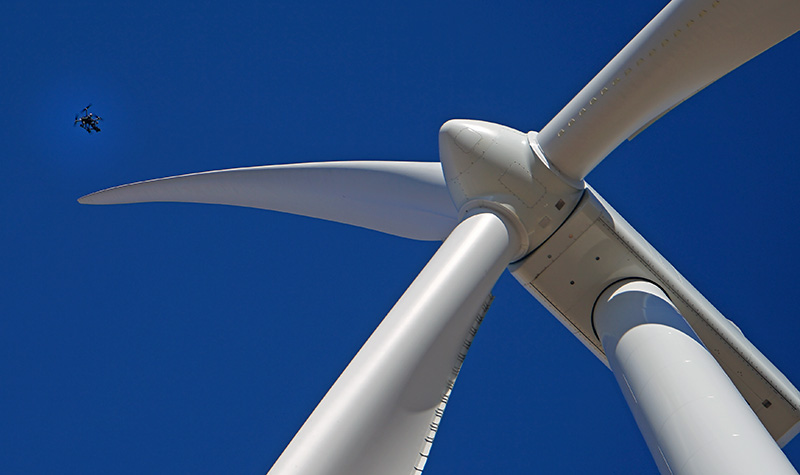 Drone flies close to wind turbine