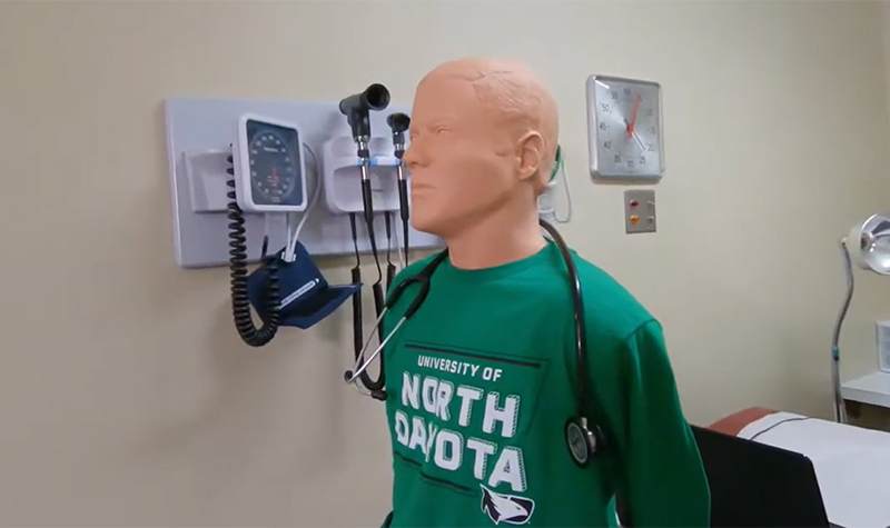 Mannequin wearing UND shirt and stethoscope