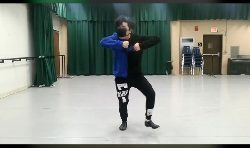Person dancing, wearing face mask