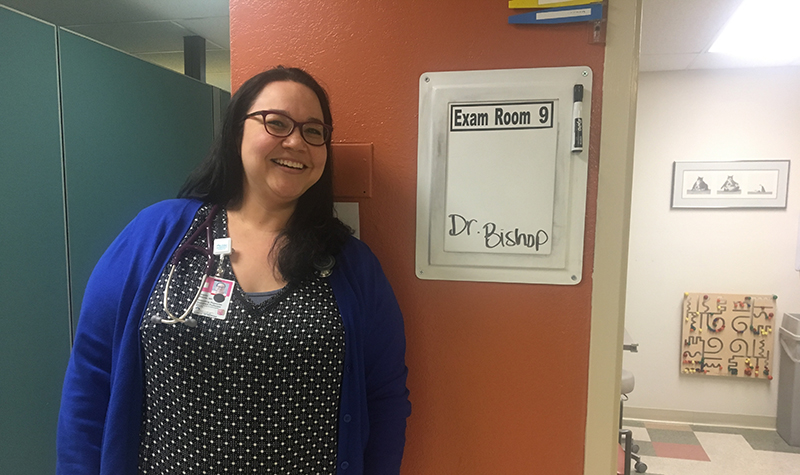 Charity Bishop in front of exam room