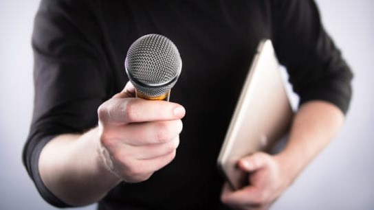 Person holding microphone
