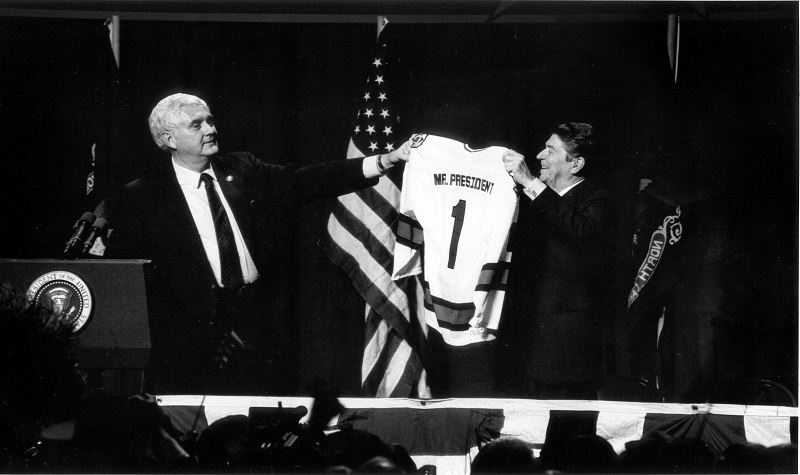 President Ronald Reagan receives UND jersey from Sen. Mark Andrews in 1986