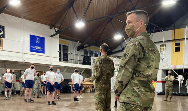 Maj. James Franciere stands with ROTC cadets
