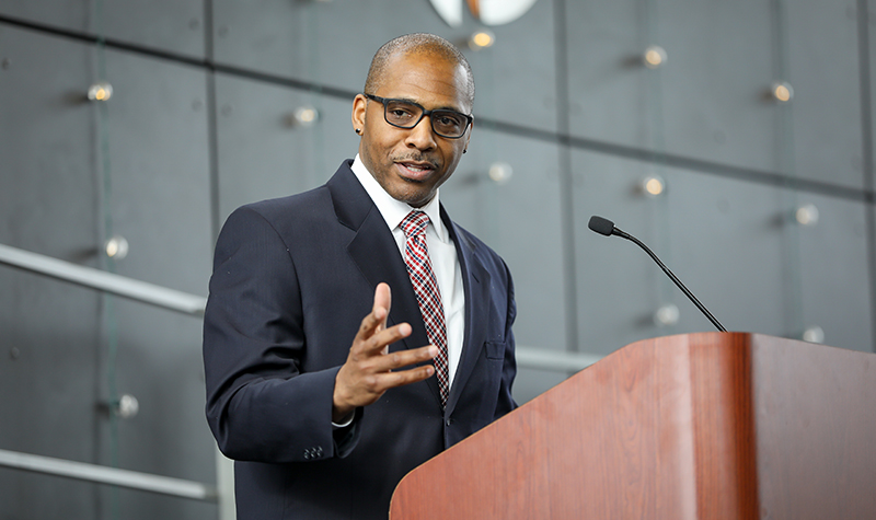 Tamba-Kuii Bailey at lectern