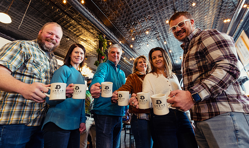 Owners of urban stampede hold identical branded mugs