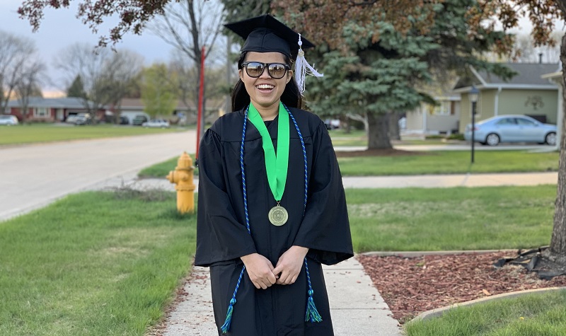 Menuka Rai in commencement hat and gown