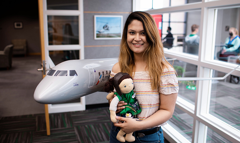 Faiza Ashraf holding doll