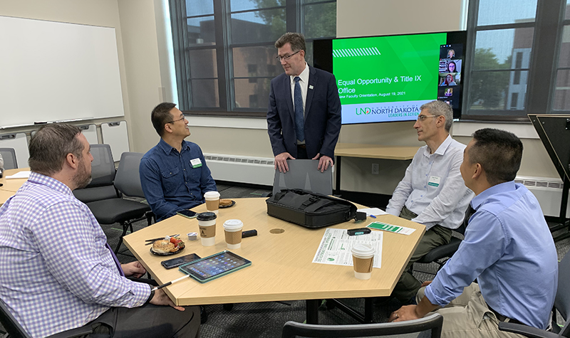 Andrew Armacost speaks with new faculty