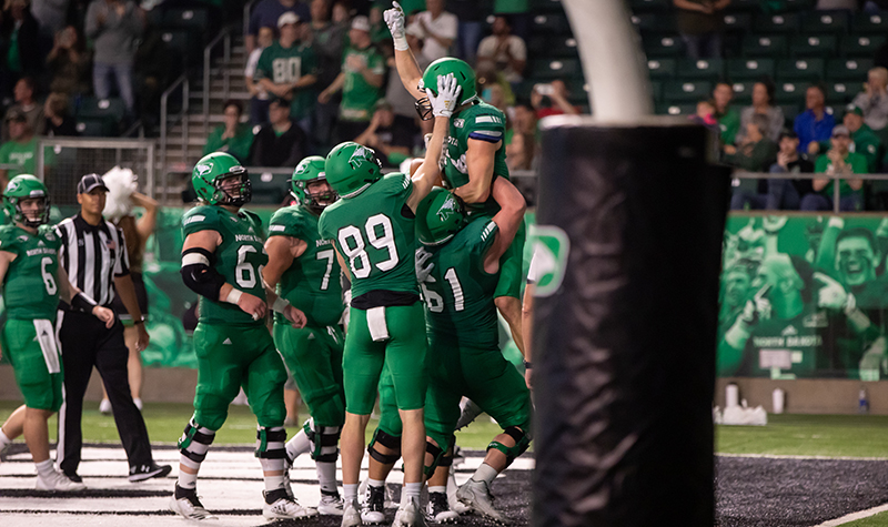 Football players celebrate touchdown