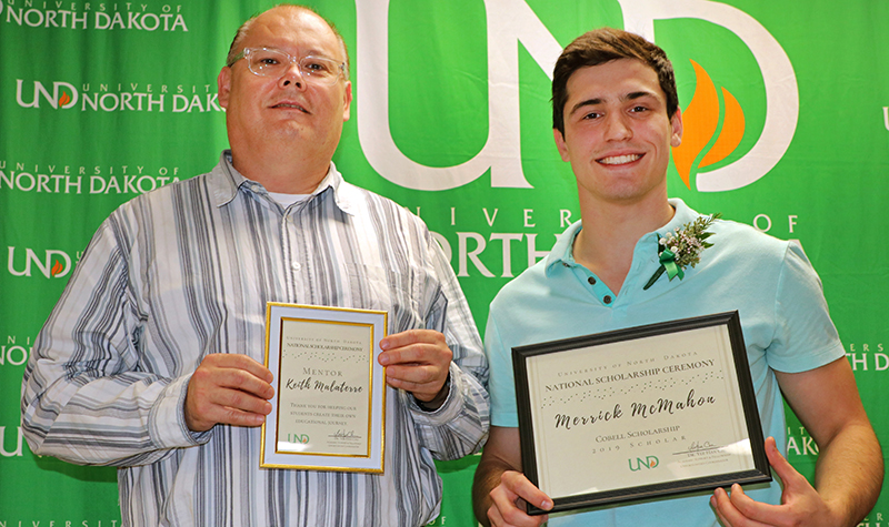 Keith Malaterre and Merrick McMahon hold certificates