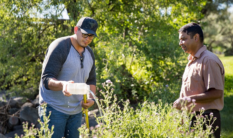 Taufique Mahmood with student colleague check water sample