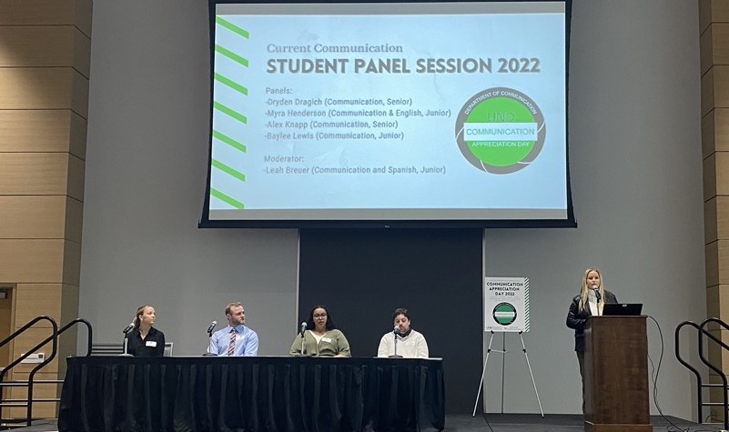 Panelists on stage for student panel session