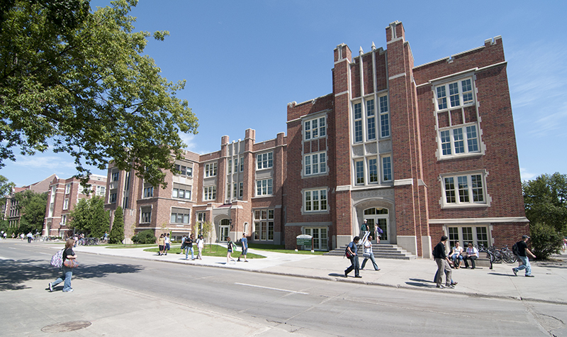Students walking in front of education building