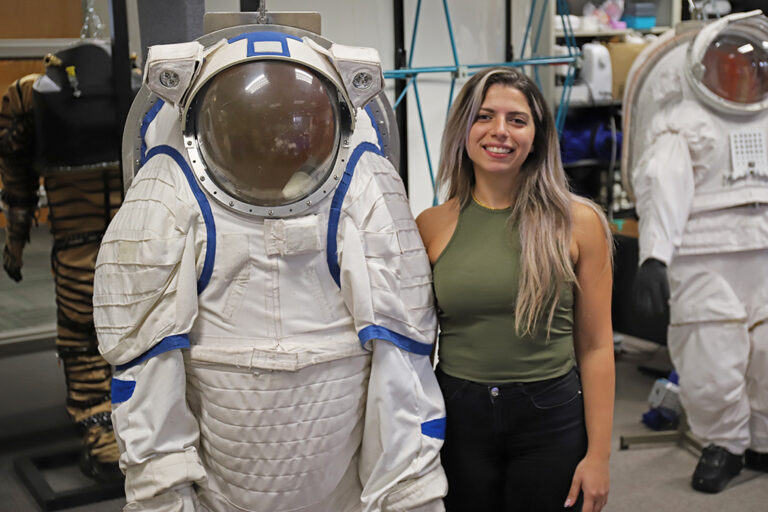 Sara Sabry next to space suit