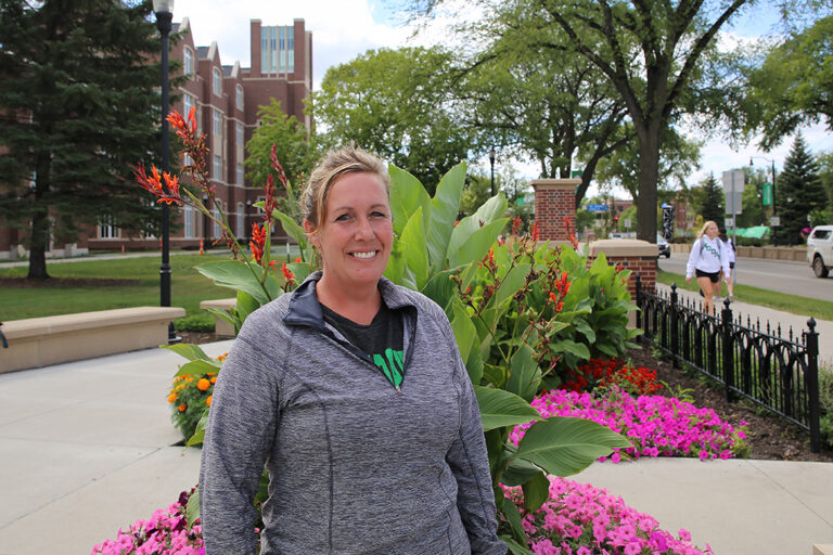 Melissa Grafenauer in front of flowers