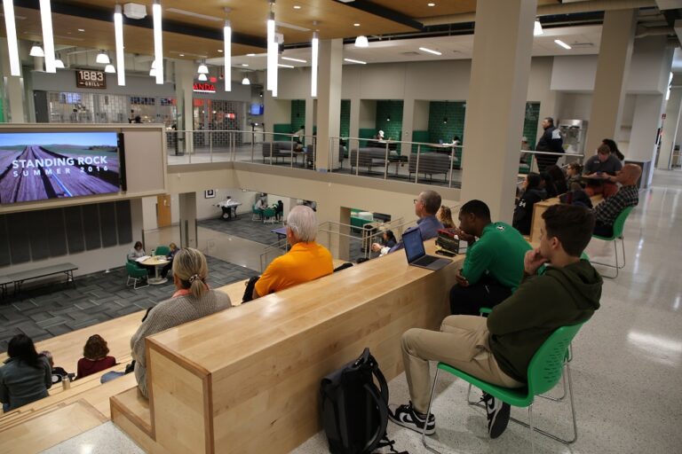 People in Memorial Union watching film