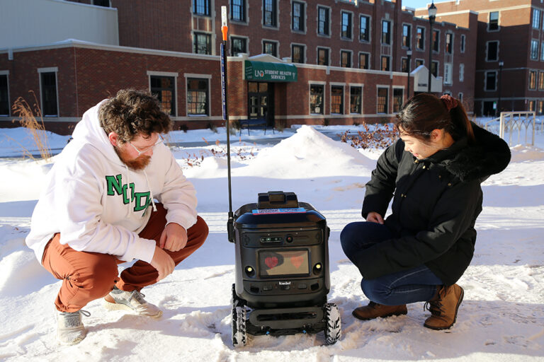 Students check out kiwibot