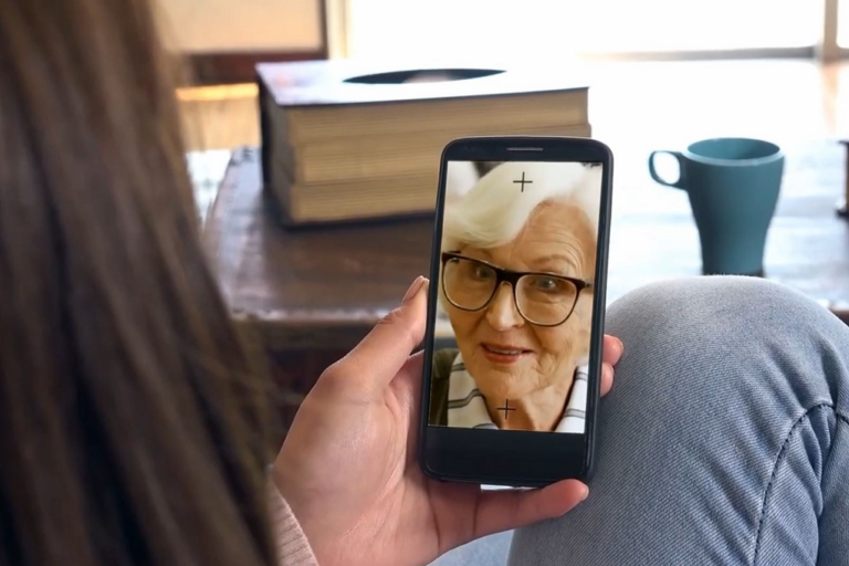 Woman appearing on phone screen