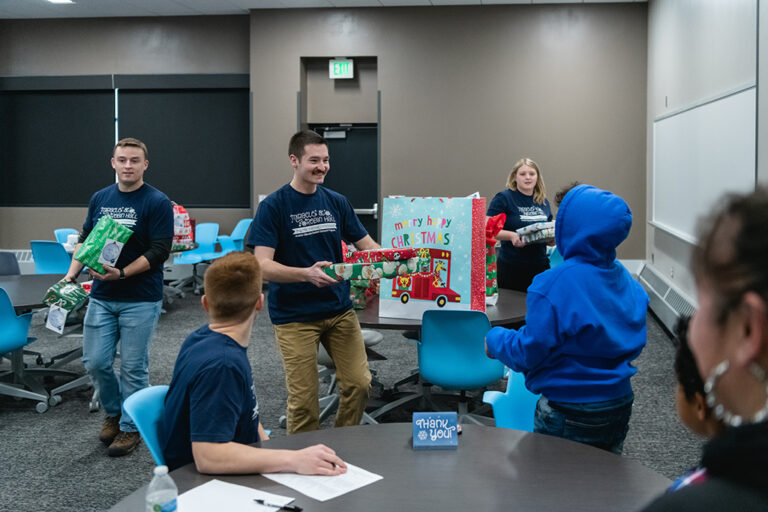 Students hand out gifts