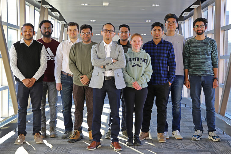 Sougata Roy stands with research group