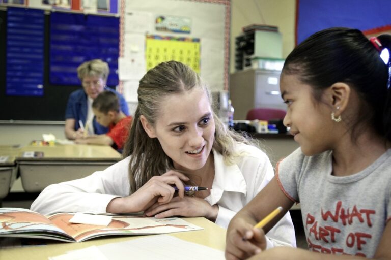 Teacher with student