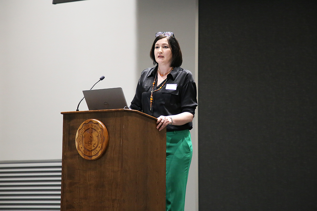 woman speaking at podium