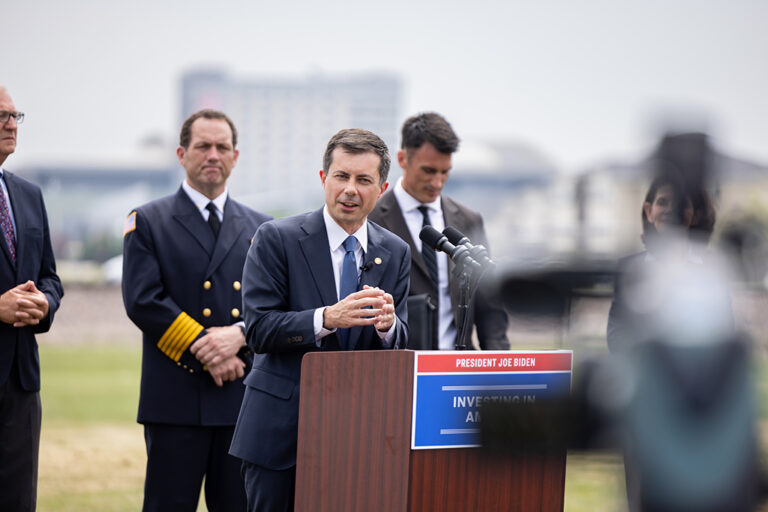 Pete Buttigieg speaking at podium
