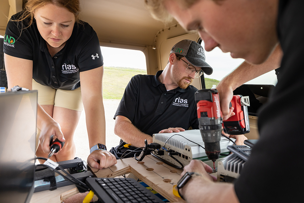 Students work in Humvee