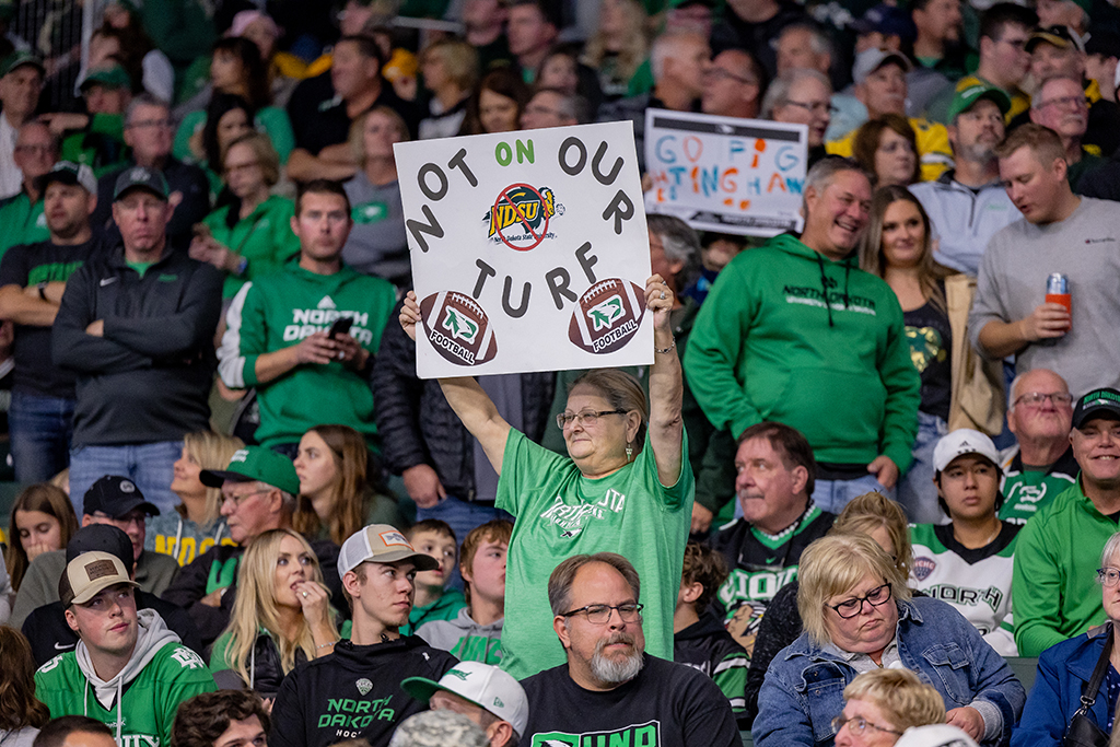 Fan holding sign