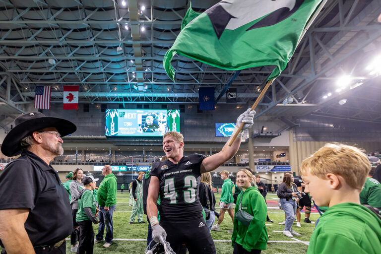 Waving the Fighting Hawks flag