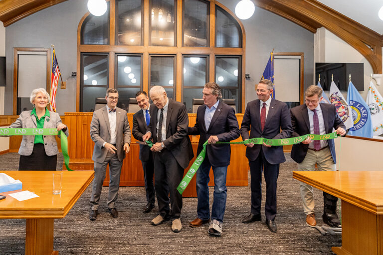 Gerald VandeWalle cuts ribbon as Gov. Doug Burgum, Drew Wrigley and Andrew Armacost look on