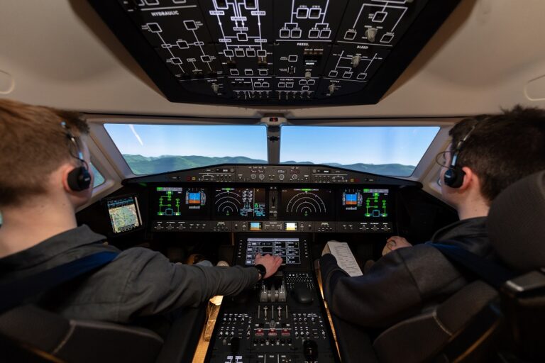 Students in cockpit of simulator