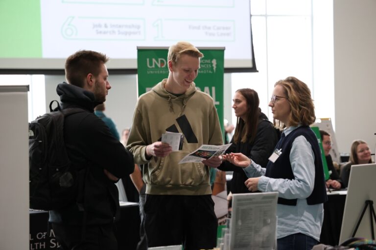 Students converse with faculty at Major-Minor Fair