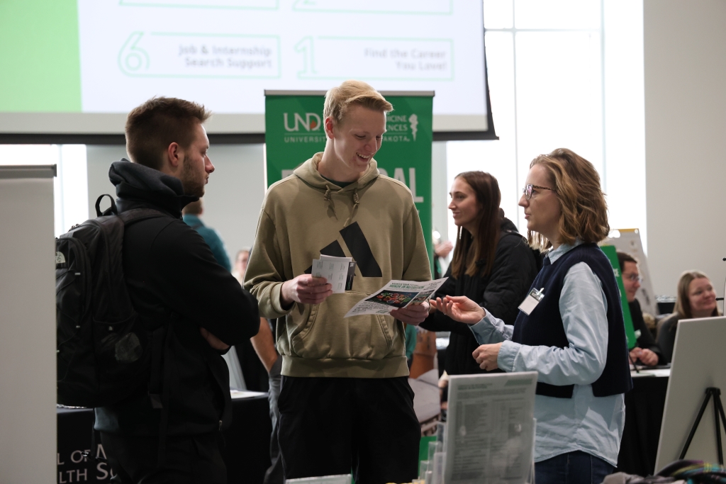 Students converse with faculty at Major-Minor Fair